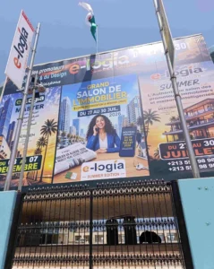Façade du Centre des Conventions d'Oran affichant le salon immobilier E-LOGIA 2026